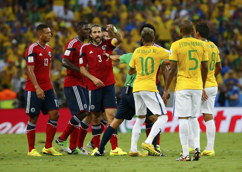 Brazil and Colombia players argue during their 2014 World Cup quarter-finals at the Castelao arena in Fortaleza July 4, 2014. REUTERS/Yves Herman