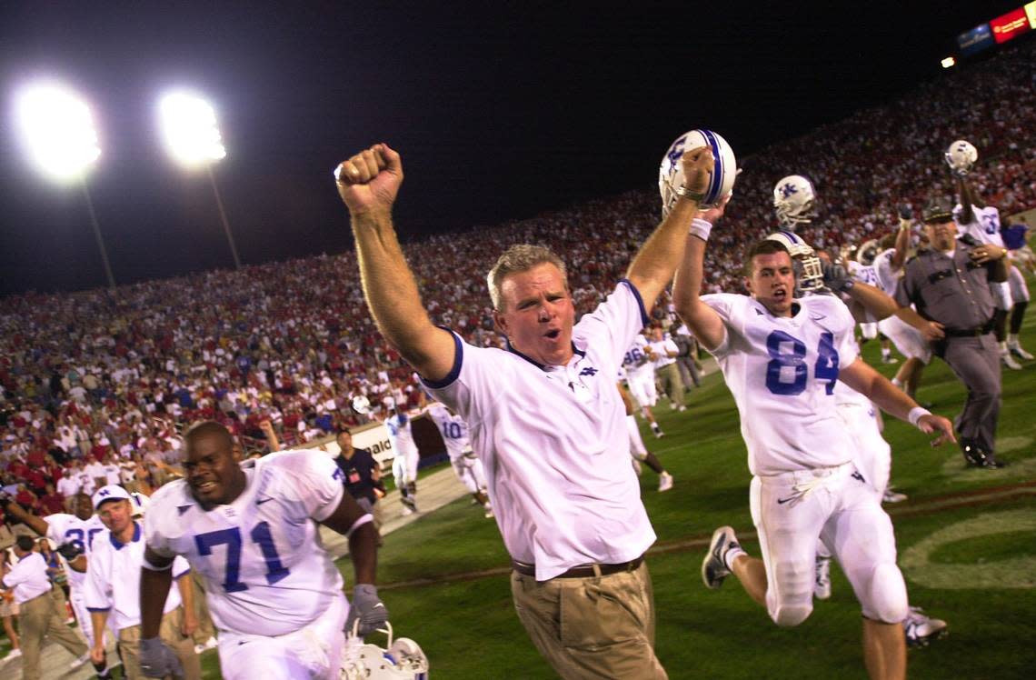 UK head coach Guy Morriss celebrates after the University of Kentucky defeated the University of Louisville, 22-17, at Papa John’s Stadium in Lousiville, Ky., Sunday September 1, 2002.