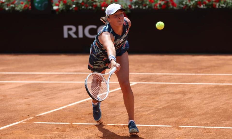 Iga Swiatek hits a forehand shot in the Italian Open final