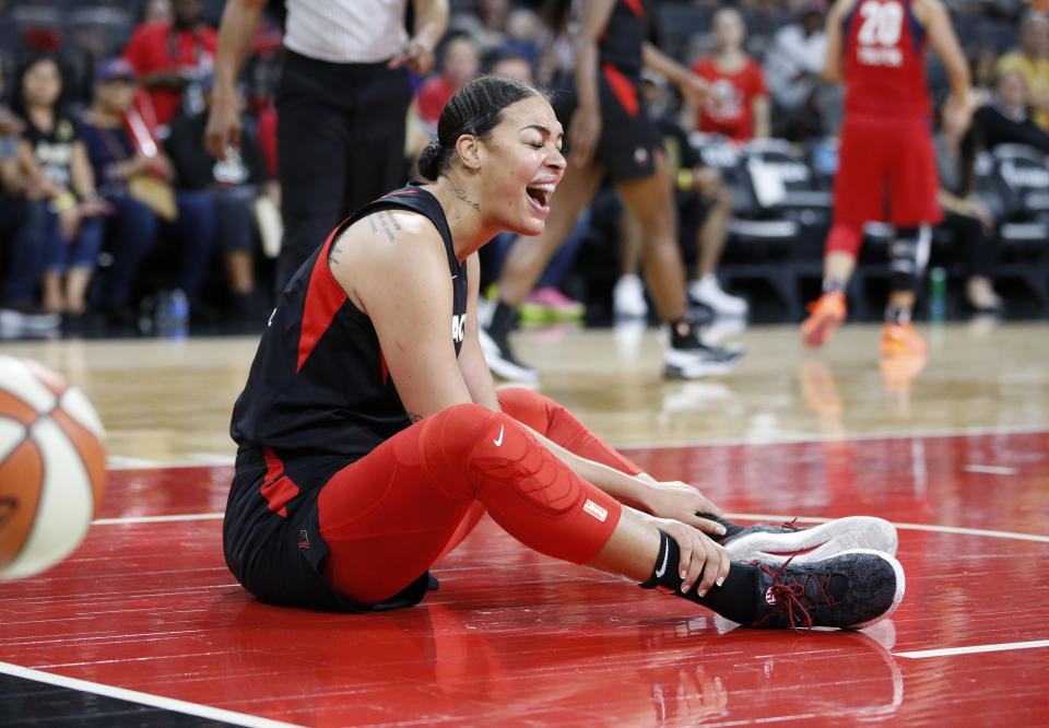 Las Vegas Aces' Liz Cambage reacts after she was called for a foul against the Washington Mystics during the first half of Game 4 of a WNBA playoff basketball series Tuesday, Sept. 24, 2019, in Las Vegas. (AP Photo/John Locher)