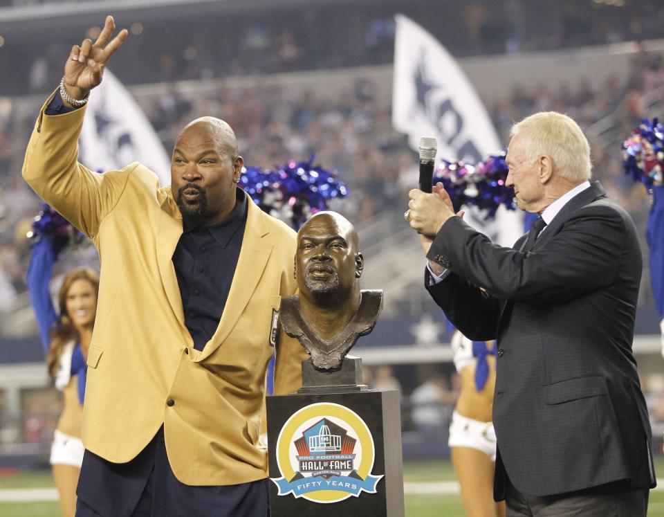 Larry Allen, left, with Jerry Jones and Allen's Hall Of Fame bust at AT&T Stadium in Arlington, Texas, on Sunday, October 13, 2013. (Ron Jenkins/Fort Worth Star-Telegram/Tribune News Service via Getty Images)