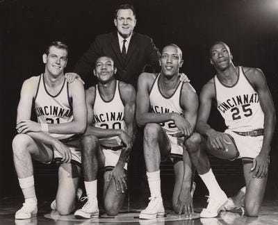 UC Coach Ed Jucker with some of the key players from his 1962 NCAA champion Bearcats: Ron Bonham, from left, Tony Yates, George Wilson and Tom Thacker. Enquirer file