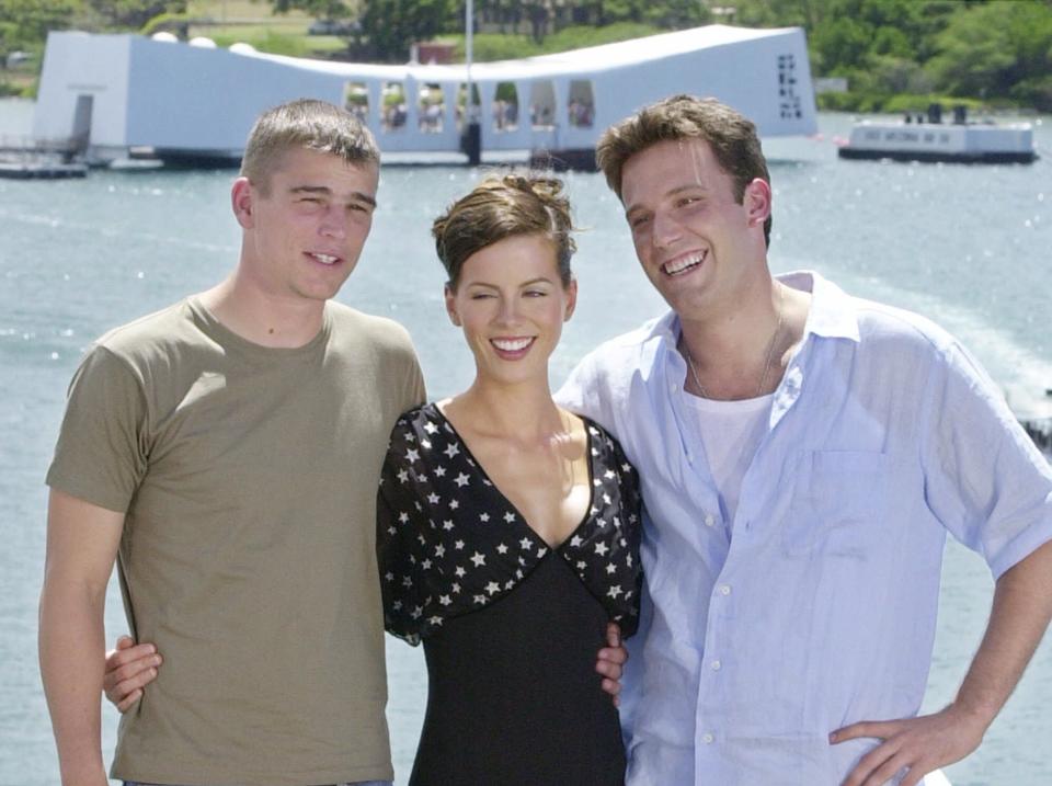 "Pearl Harbor" lead actor Ben Affleck, right, is joined by actress Kate Beckinsale, center, and Josh Hartnett, on the flight deck of the USS John C. Stennis on Sunday, May 20, 2001.  Disney has transformed the Navy aircraft carrier into a mammoth moviehouse for the launch of its summer blockbuster. The movie opens in theaters Friday.(AP Photo/Kevork Djansezian)