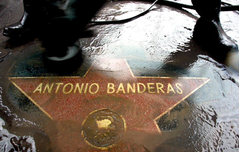 The star of actor Antonio Banderas is polished on the Walk of Fame in Hollywood October 18, 2005. Banderas will receive the star later Tuesday. REUTERS/Mario Anzuoni