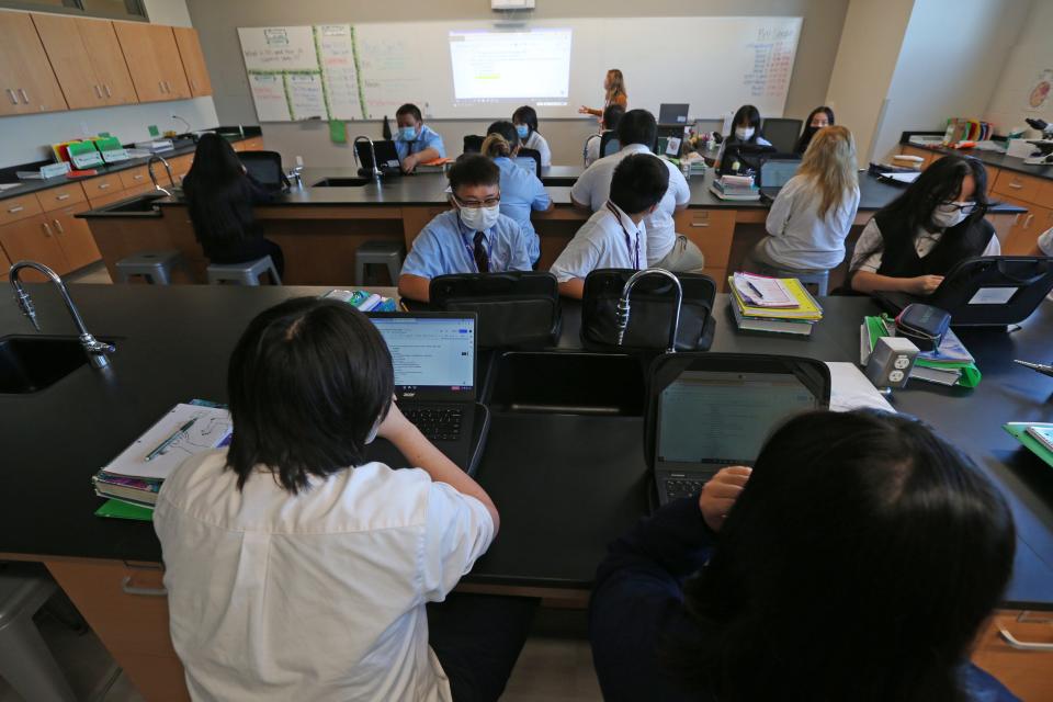 Biology teacher Abbie Baumann teaches in the new building of The Hmong American Peace Academy.