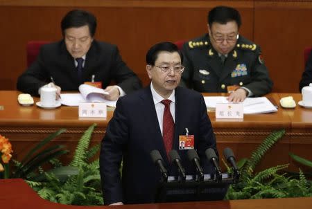 China's parliament chief Zhang Dejiang delivers a work report during the second plenary session of China's parliament, the National People's Congress, at the Great Hall of the People in Beijing, March 8, 2015. REUTERS/Jason Lee