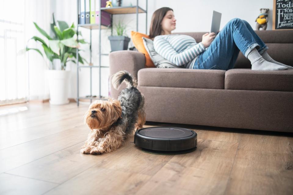 A robot vacuum cleans the floor.