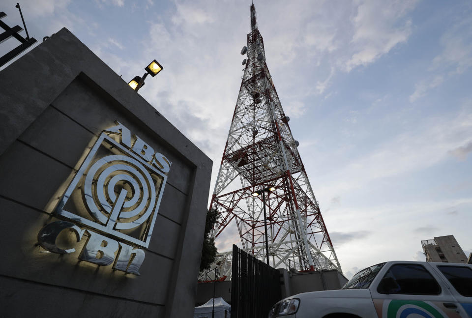 A vehicle enters the property of the broadcast network ABS-CBN on Tuesday, May 5, 2020, in Manila, Philippines. A government agency has ordered ABS-CBN, the country's leading broadcast network, which the president has targeted for its critical news coverage, to halt operations. (AP Photo/Aaron Favila)