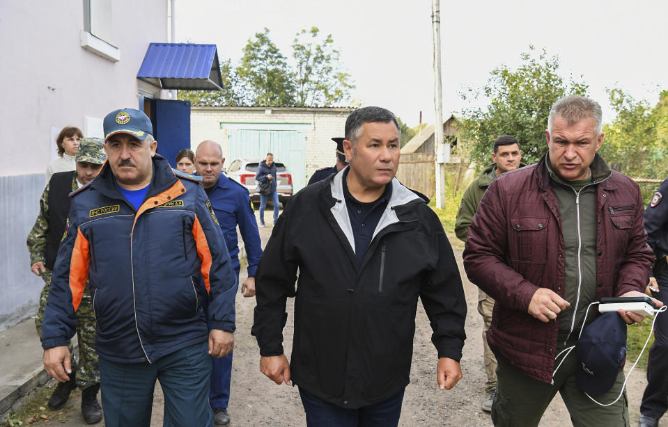 In this photo released by Press Service of the Government of the Tver Region of Russia on Wednesday, Sept. 18, 2024, Tver region governor Igor Rudenya, center, arrives to attend a meeting of the operational headquarters in Toropets, following the strike by Unmanned Aerial Vehicles in Toropets, Russia. (Press Service of the Government of the Tver Region of Russia via AP)