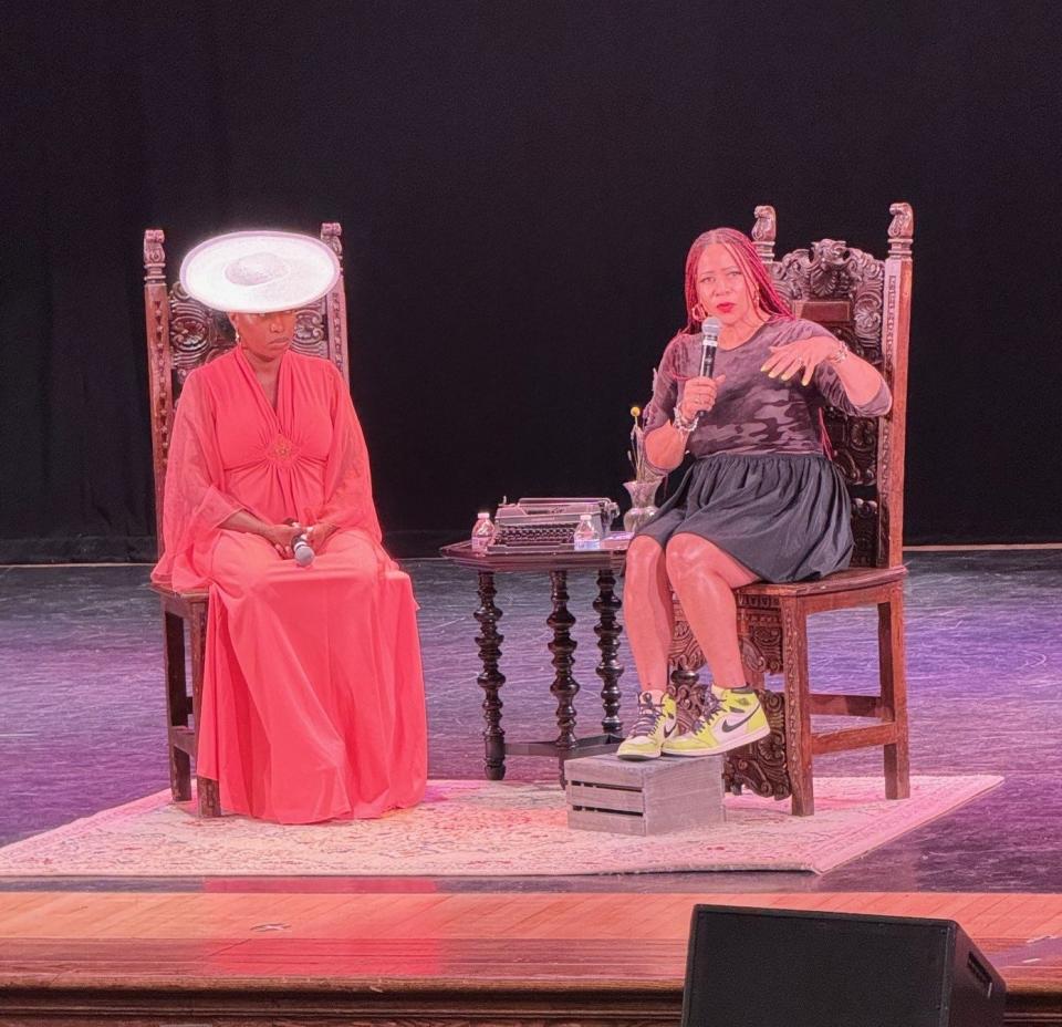 Jeannine A. Cook, (left) owner of Ida's Bookshop in Collingswood, sits on stage with Pulitzer Prize-winning journalist Nikole Hannah-Jones at the Scottish Rite Auditorium in Collingswood on July 9.