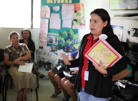 A health worker (R) at the Ciudad Mujer (Women City) center gives a workshop on breast cancer prevention in Santa Ana, October 23, 2014. REUTERS/Anastasia Moloney