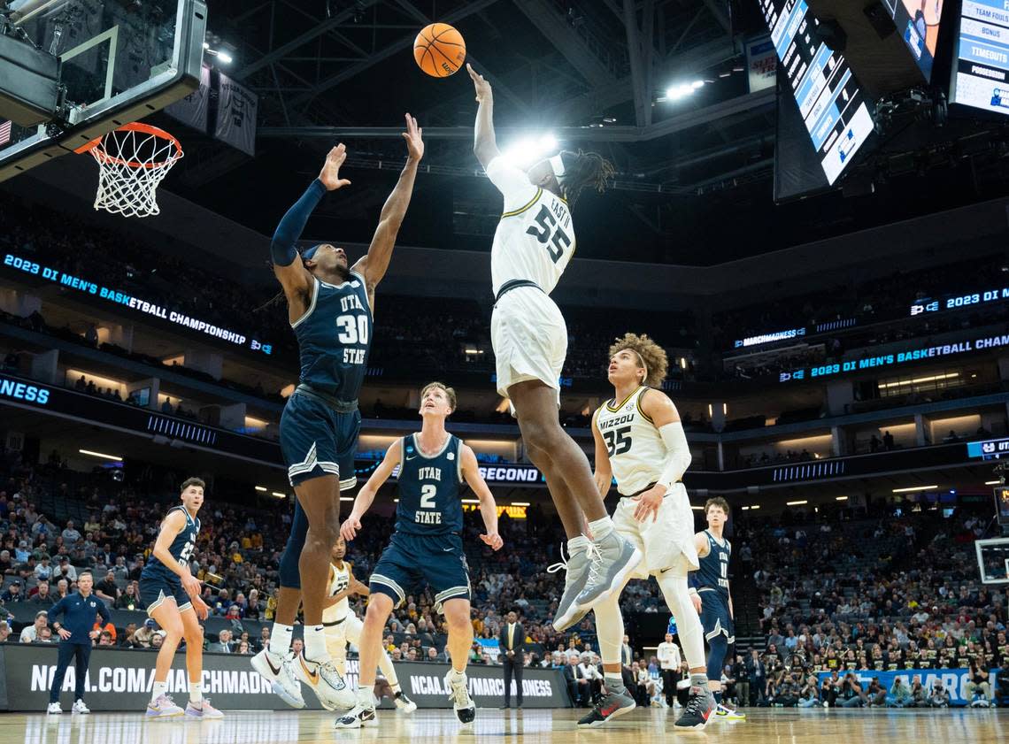 Missouri Tigers guard Sean East II (55) shoots over Utah State Aggies forward Dan Akin (30) for a basket during a game for the NCAA Tournament at Golden 1 Center in Sacramento, Thursday, March 16, 2023.