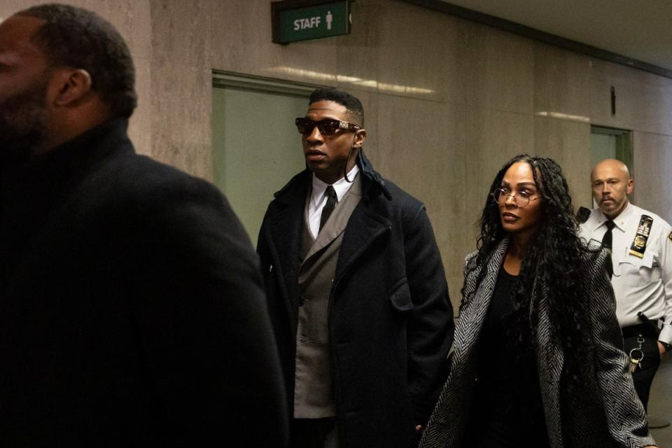 Actors Jonathan Majors, center, and Meagan Good arrive at court for a jury selection on Major's domestic violence case, Wednesday, Nov. 29, 2023, in New York. (AP)