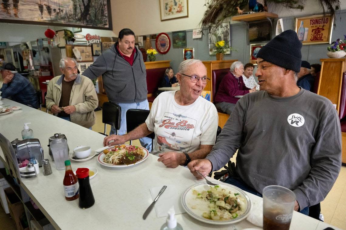 First time customer Dick Williams, left, sits at the counter with Felix Cano who has been coming to the Chicago Cafe for 55 years on Feb. 23, in Woodland. Generations of families have been coming here and UC Davis recently confirmed that Chicago Cafe is the oldest Chinese restaurant in California. Paul Kitagaki Jr./pkitagaki@sacbee.com