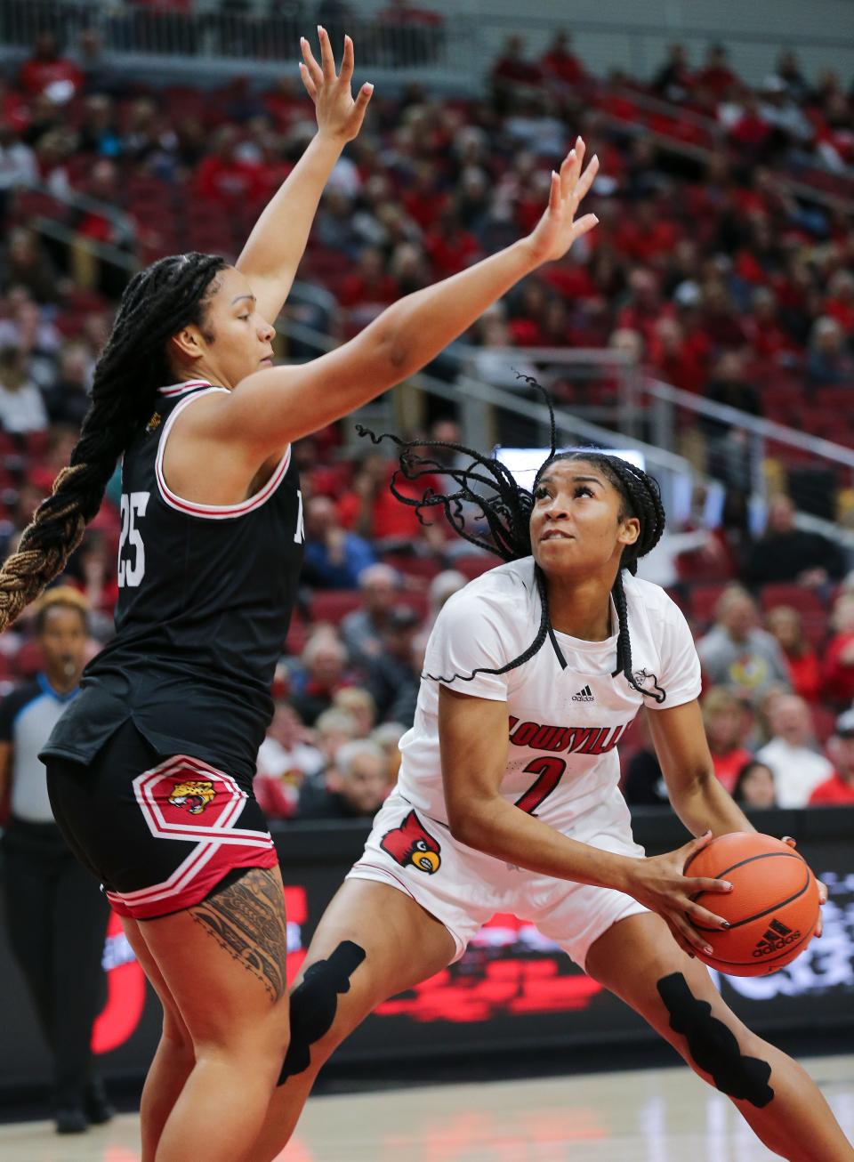 U of L's Nyla Harris (2) looked for room to operate against IUPUI's Brianna Wooldridge (25) during their game at the Yum Center in Louisville, Ky. on Nov. 10, 2022.