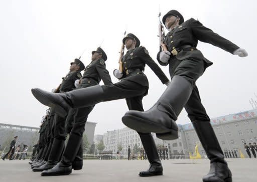 Members of the Guards of Honour of the Three Services of the Chinese People's Liberation Army (PLA) practise during a training session at a barracks in Beijing in 2011. China's cyber warfare capabilities have reached a point where they would pose a danger to the US military in the event of a conflict, according to a report prepared for the US Congress released on Thursday