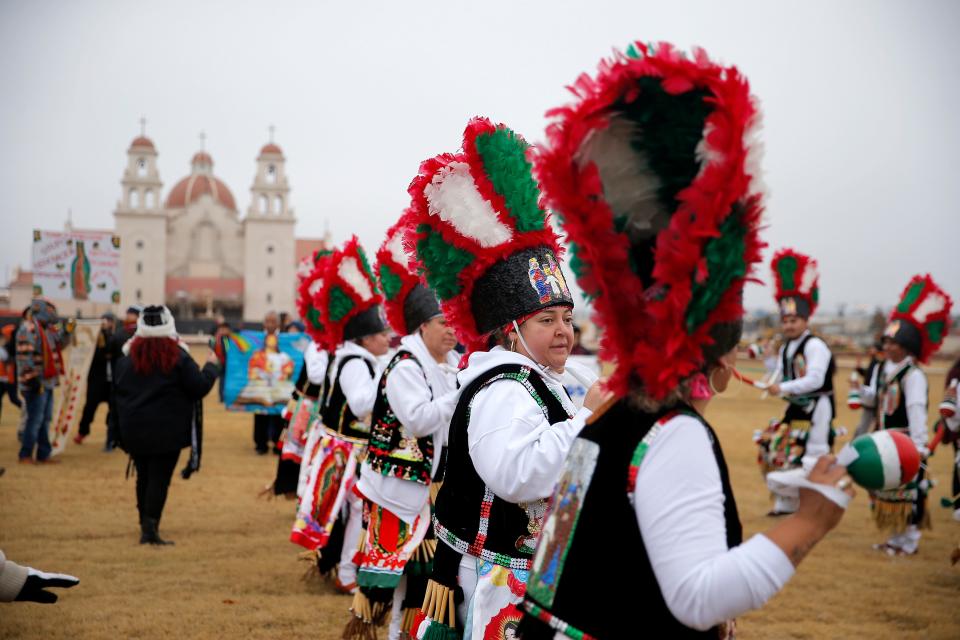 Dancers perform before an outdoor Mass and dedication of Tepeyac Hill on Sunday at the Blessed Stanley Rother Shrine in Oklahoma City.