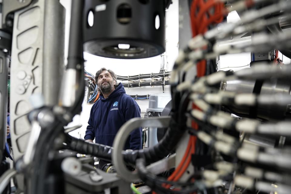 Andy O'Brien explains how he pilots the remotely operated dive vehicle Deep Discoverer during a tour, Friday, June 23, 2023, in Kodiak, Alaska. The ship, a reconfigured former U.S. Navy vessel run by civilians and members of the NOAA Corps, is specially outfitted with technology and tools needed to access deep into the ocean, and to share that data with the public and on-shore researchers in real-time. (AP Photo/Joshua A. Bickel)