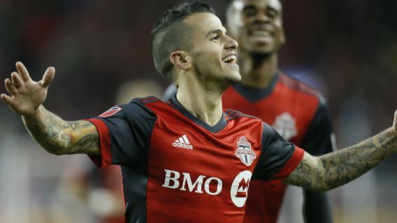 Toronto FC striker Sebastian Giovinco celebrates his opener against the Chicago Fire on Friday night. 