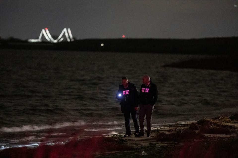 Police are seen on the beach near the Cross Bay Bridge and 165 Ave in Queens where a body was found Friday, April 12, 2024. Robert Mecea