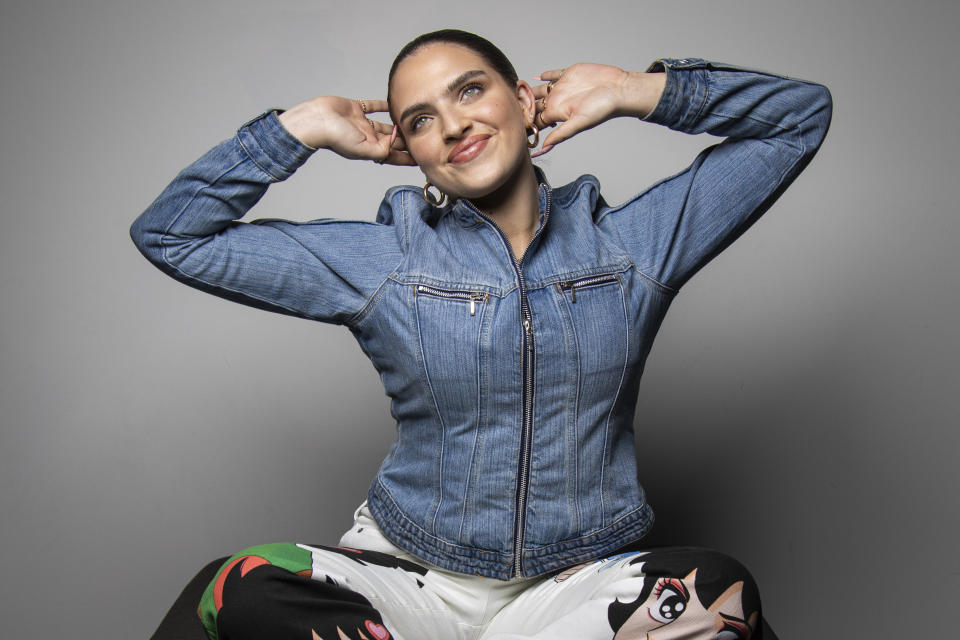 Mae Muller, representing the United Kingdom in the Eurovision Song Contest poses for a photographer, in London Tuesday, March 14, 2023. (Photo by Vianney Le Caer/Invision/AP)