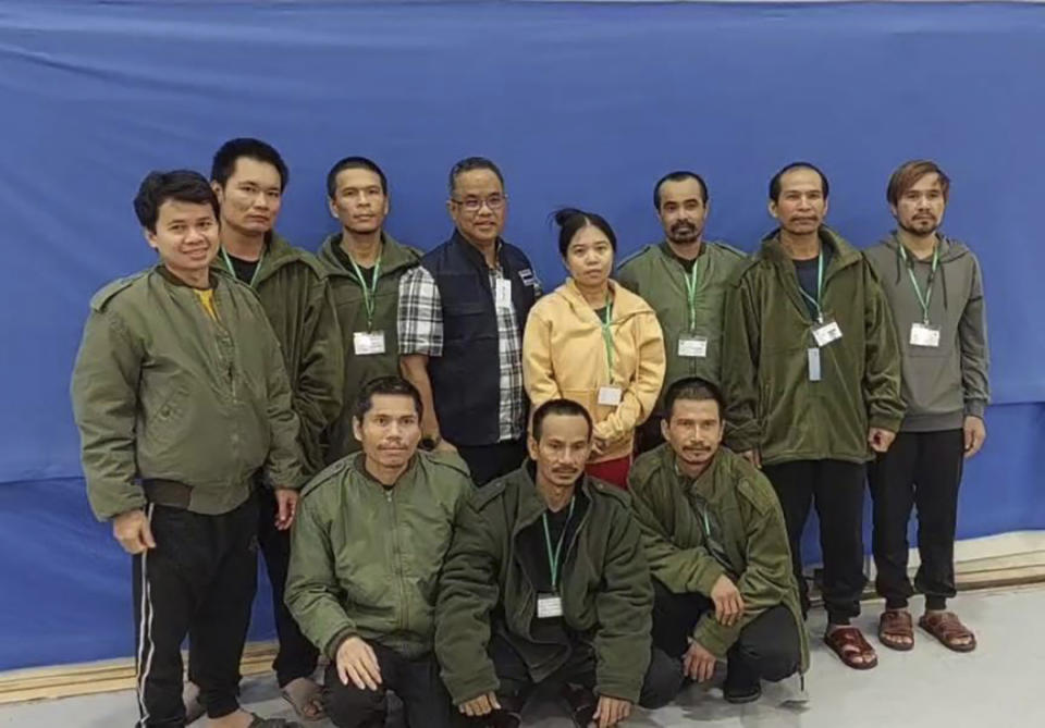 In this photo provided by Thailand's Foreign Ministry, ten of freed Thai hostages and an officer, fourth from left, pose for a photo at the Shamir Medical Center in Israel Friday, Nov. 24, 2023. Hamas freed 10 Thai nationals seized in the group’s surprise attack on southern Israel last month, releasing them alongside Israeli hostages who were part of the first swap under a new cease-fire deal.(Thailand's Foreign Ministry via AP )