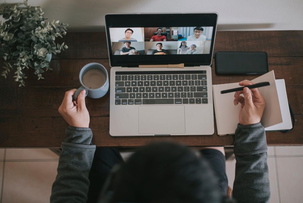 A remote worker attends a virtual meeting on their laptop.