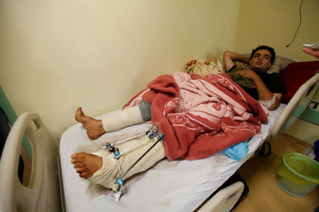 A wounded fighter from Misrata central operation room, who was injured during a truck bomb explosion at Abu-ghrain, lies on a bed inside a hospital in Misrata, Libya May 10, 2016. REUTERS/Ismail Zitouny