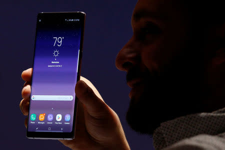 A guest shows the new Galaxy Note 8 smartphone during the launch event in New York City, U.S., August 23, 2017. REUTERS/Brendan McDermid