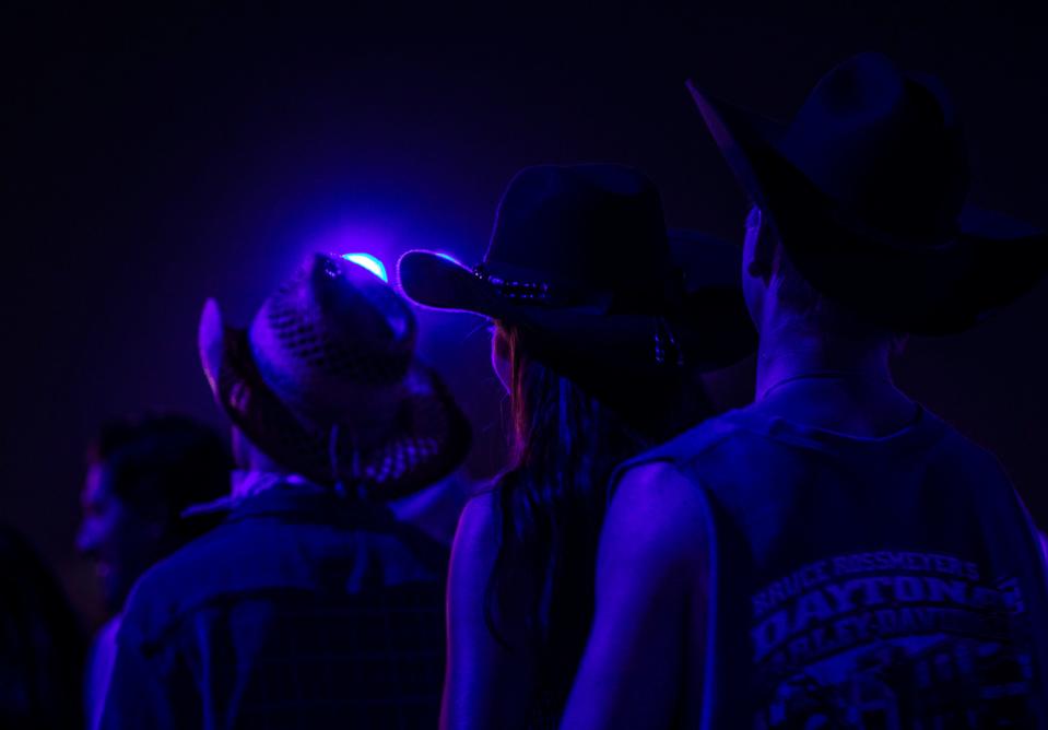 Festivalgoers listen as Luke Bryan performs his headlining set on the Mane stage at Stagecoach at the Empire Polo Club in Indio, Calif., Friday, April 28, 2023. 