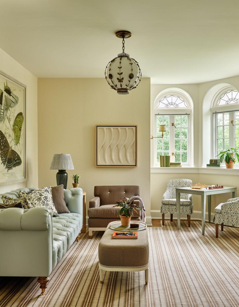 a living room with a chandelier and a couch