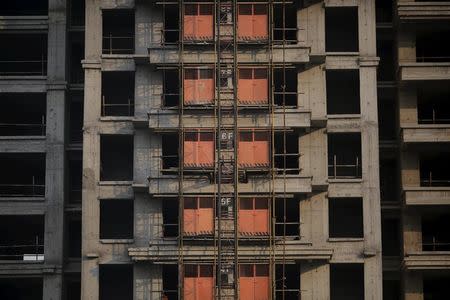 Unfinished apartments are seen at the construction site of Zixia Garden development complex in Qianan, Tangshan City, Hebei province, China January 28, 2016. REUTERS/Damir Sagolj