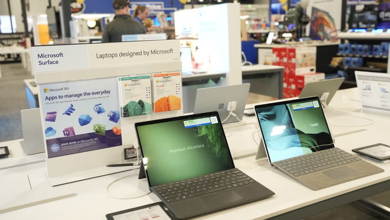 Laptops sit on display in a Best Buy store Tuesday, Nov. 21, 2023, in southeast Denver.