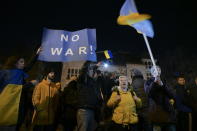 FILE - People protest against Russia's military operation in Ukraine during a demonstration organized by the Hungarian opposition parties in front of the Russian embassy in Budapest, Hungary, Thursday, Feb. 24, 2022. Hungary’s right-wing nationalist prime minister, Viktor Orban, has nurtured close political and economic ties with Russia for more than a decade. But following Russia's large-scale invasion of Ukraine, Hungary's neighbor, Orban is facing growing pressure to change course. (Szilard Koszticsak/MTI via AP, File)