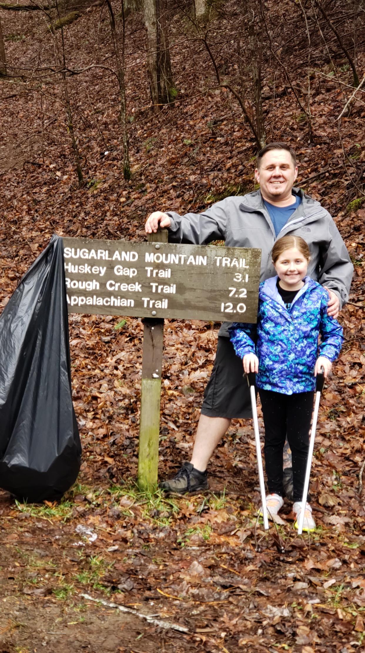 Marc and Erica Newland clean up litter at Great Smoky Mountain National Park.