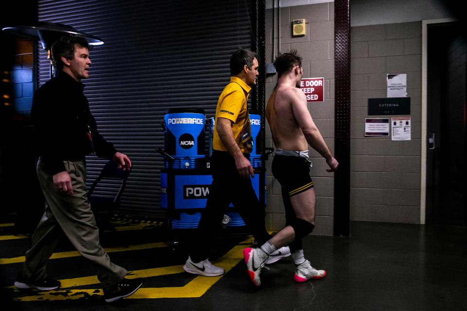 Iowa's Spencer Lee reacts after getting pinned by Purdue's Matt Ramos at 125 pounds in the semifinals during the fourth session of the NCAA Division I Wrestling Championships, Friday, March 17, 2023, at BOK Center in Tulsa, Okla.