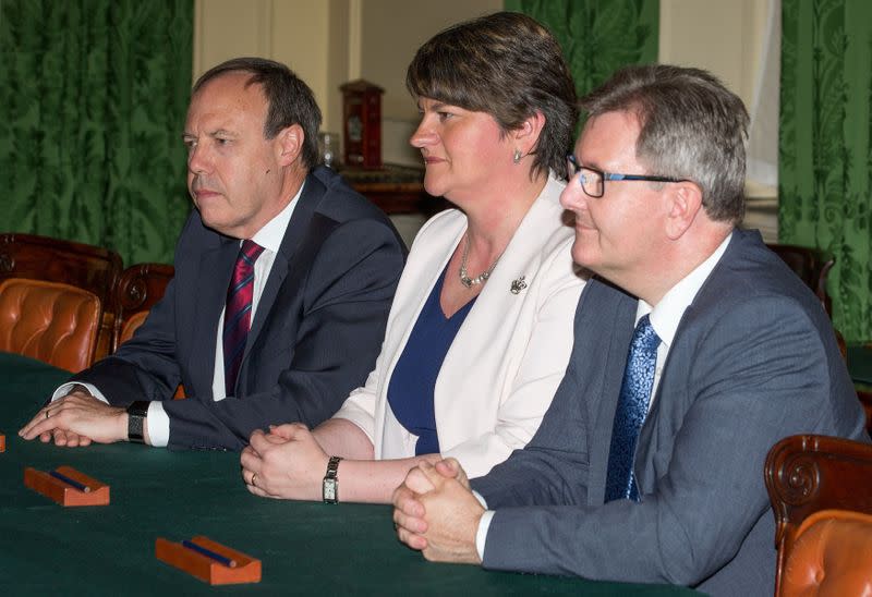 FILE PHOTO: Democratic Unionist Party leader Arlene Foster sits opposite Britain's Prime Minister Theresa May inside 10 Downing Street, London