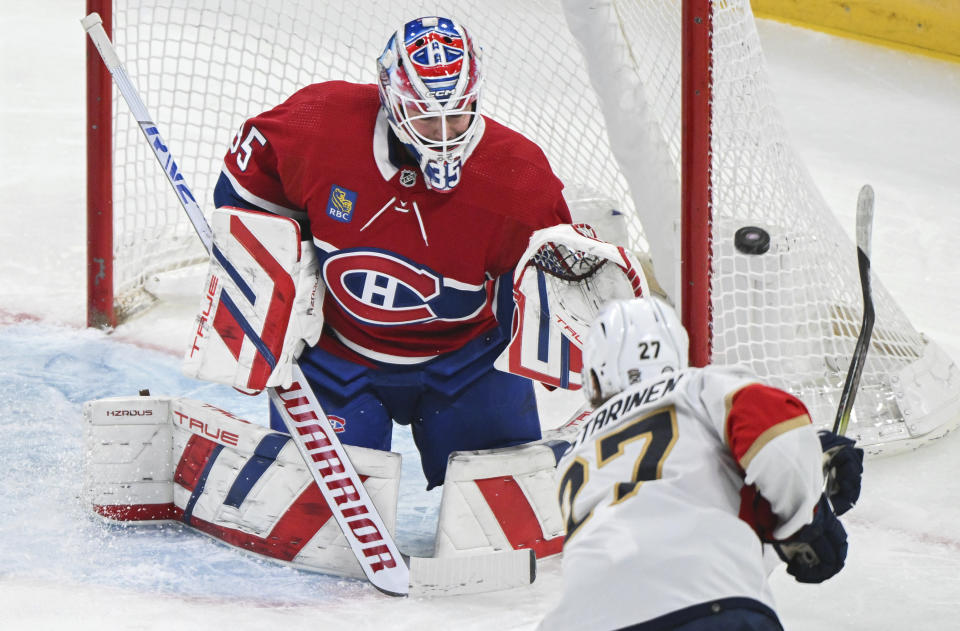 Florida Panthers' Eetu Luostarinen (27) takes a shot on Montreal Canadiens goaltender Sam Montembeault during the first period of an NHL hockey game in Montreal, Tuesday, April 2, 2024. (Graham Hughes/The Canadian Press via AP)