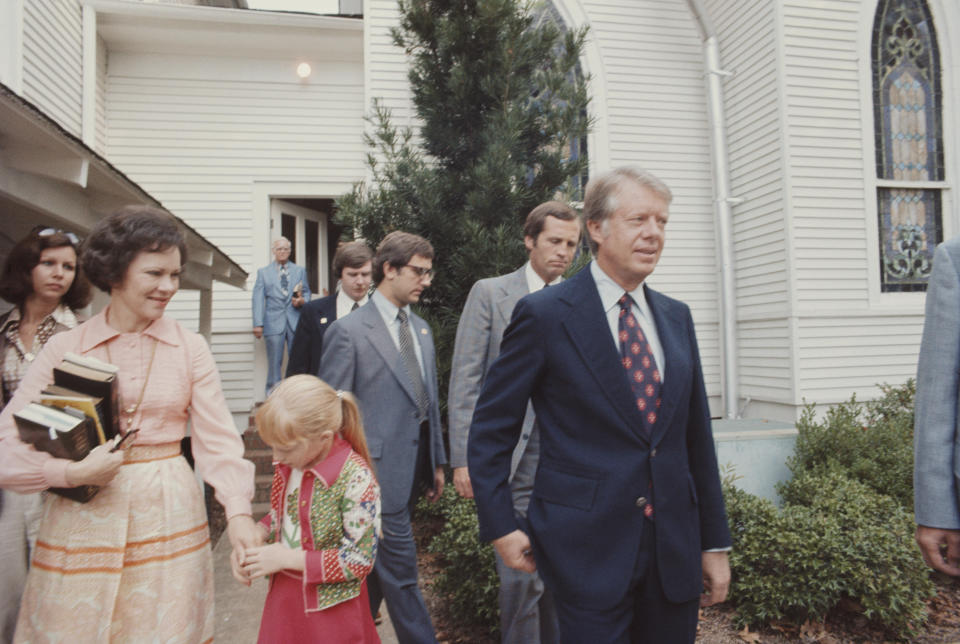 Jimmy Carter with wife Rosalynn Carter and their daughter Amy at the Baptist church in his hometown of Plains, Georgia, in 1976. / Credit: / Getty Images