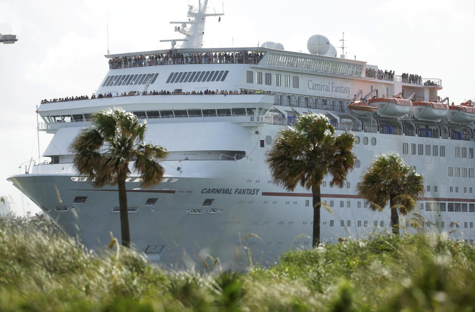 FILE - In this Monday, June 20, 2016, file photo, the Carnival Fantasy cruise ship leaves PortMiami, in Miami Beach, Fla. Top Carnival Corp. executives are due back in court to explain what the world's largest cruise line is doing to reduce ocean pollution. A hearing is set Wednesday, Oct. 2, 2019, in Miami federal court for an update on what steps Carnival is taking. (AP Photo/Lynne Sladky, File)