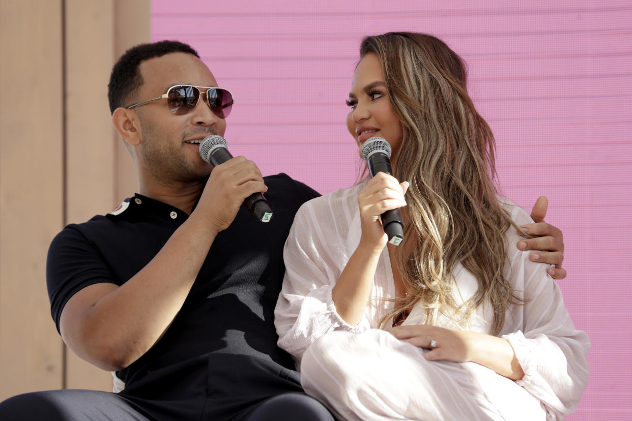 CANNES, FRANCE - JUNE 18: Chrissy Teigen and John Legend go behind the Tweets at #TwitterBeach at Cannes Lions on June 18, 2019 in Cannes, France. (Photo by Xavi Torrent/Getty Images for Twitter)