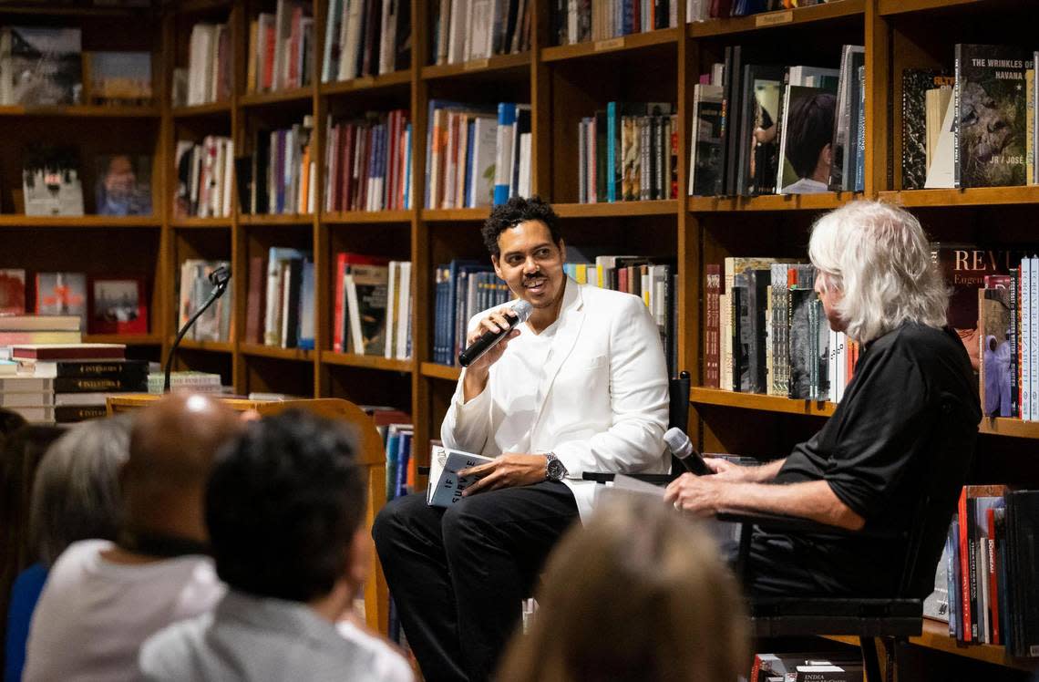 Jonathan Escoffery, left, talks with his former FIU professor and fellow novelist John Dufresne during an appearance at Books & Books in Coral Gables in September.