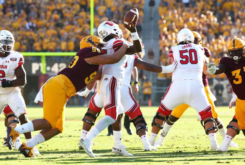 Arizona State defensive lineman Jermayne Lole forces a fumble by Utah quarterback Jason Shelley in the second half on Nov. 3, 2018, at Sun Devil Stadium.