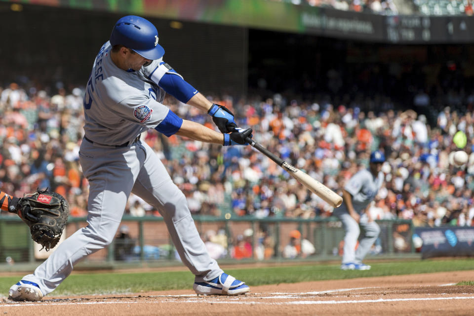 Los Angeles Dodgers David Freese hits an RBI double against the San Francisco Giants in the first inning of a baseball game in San Francisco, Sunday, Sept. 30, 2018. (AP Photo/John Hefti)