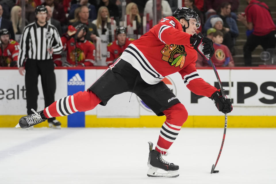 Chicago Blackhawks defenseman Alex Vlasic shoots during the second period of an NHL hockey game against the Winnipeg Jets, Friday, Feb. 23, 2024, in Chicago. (AP Photo/Erin Hooley)