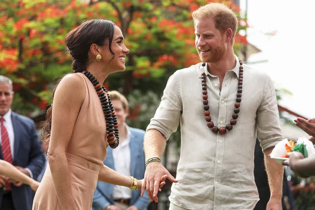 <p>KOLA SULAIMON/AFP via Getty</p> Meghan Markle and Prince Harry in Nigeria on May 10, 2024