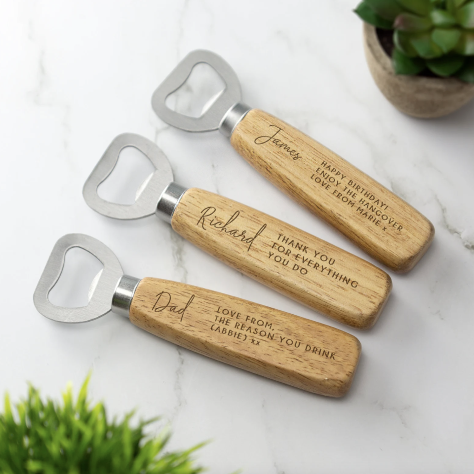 Personalized Bottle Openers in metal and wood on marble background (Photo via Etsy)