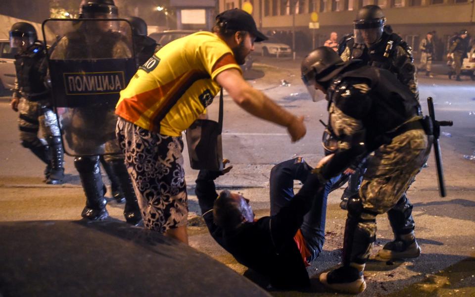 Protesters clash with police in Skopje - Credit: EPA