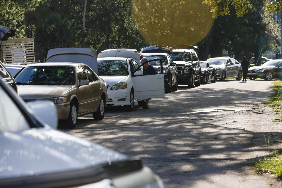 Motorists wait in line during sandbag distribution, ahead of Tropical Storm Idalia's arrival, at MacFarlane Park in Tampa, Fla., Monday, Aug. 28, 2023. (Ivy Ceballo/Tampa Bay Times via AP)