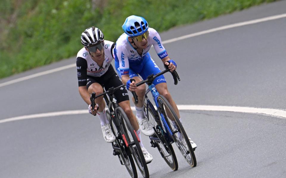 Team Jayco-Alula's Simon Yates and UAE Team Emirates' Adam Yates in action during stage one